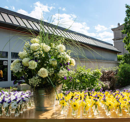 Outdoor table with vases of flowers