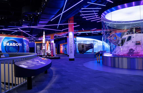 Henry Crown Space Center gallery featuring rocket models and a real capsule 