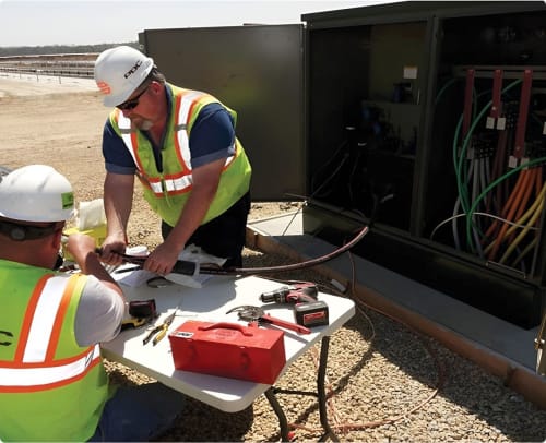 PDC Contractors on job site in reflective vests