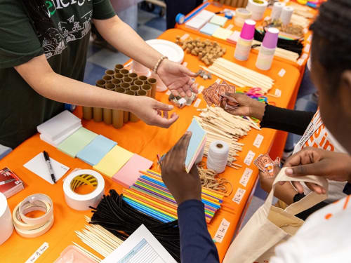 Kids trade play money for craft supplies at one of Griffin MSI's STE(A)M club events.