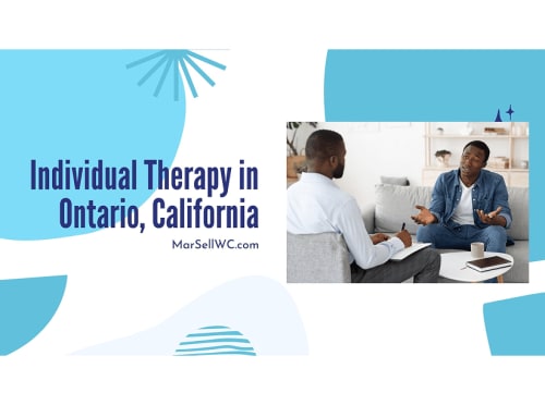 Two men speaking during a therapy session.