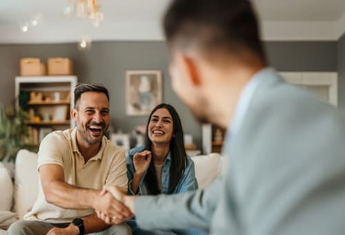 couple shakes hand with therapist 