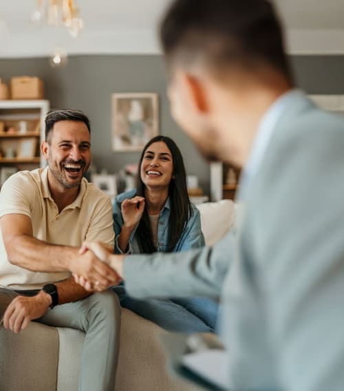 couple shakes hand with therapist 
