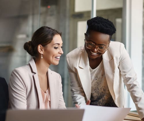 two colleagues reviewing work together