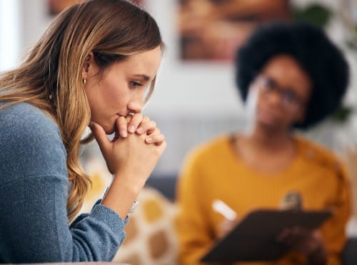 woman in an individual therapy session thinking