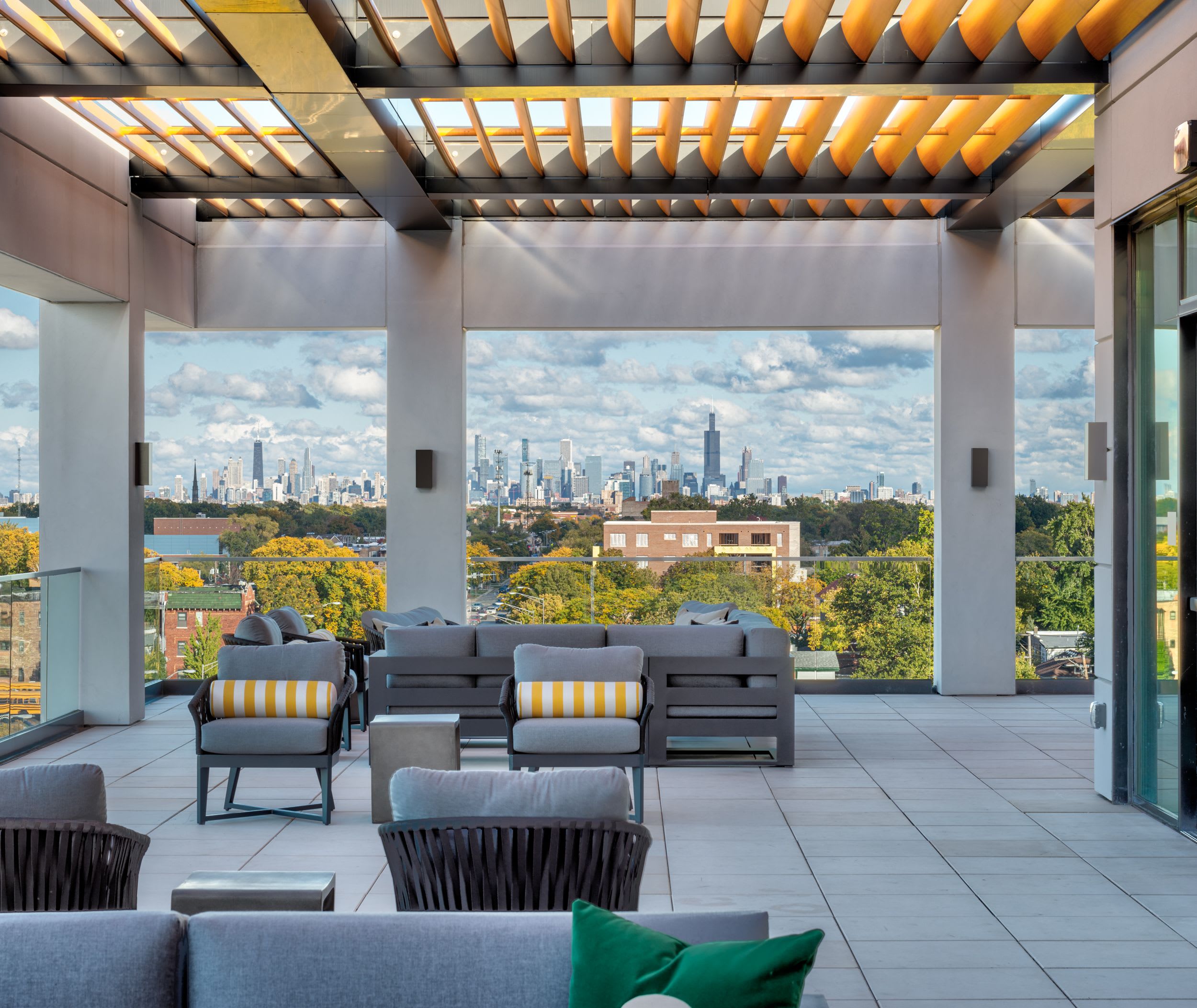 Bistro terrace at American House Oak Park Senior Living with few couches and natural lighting.