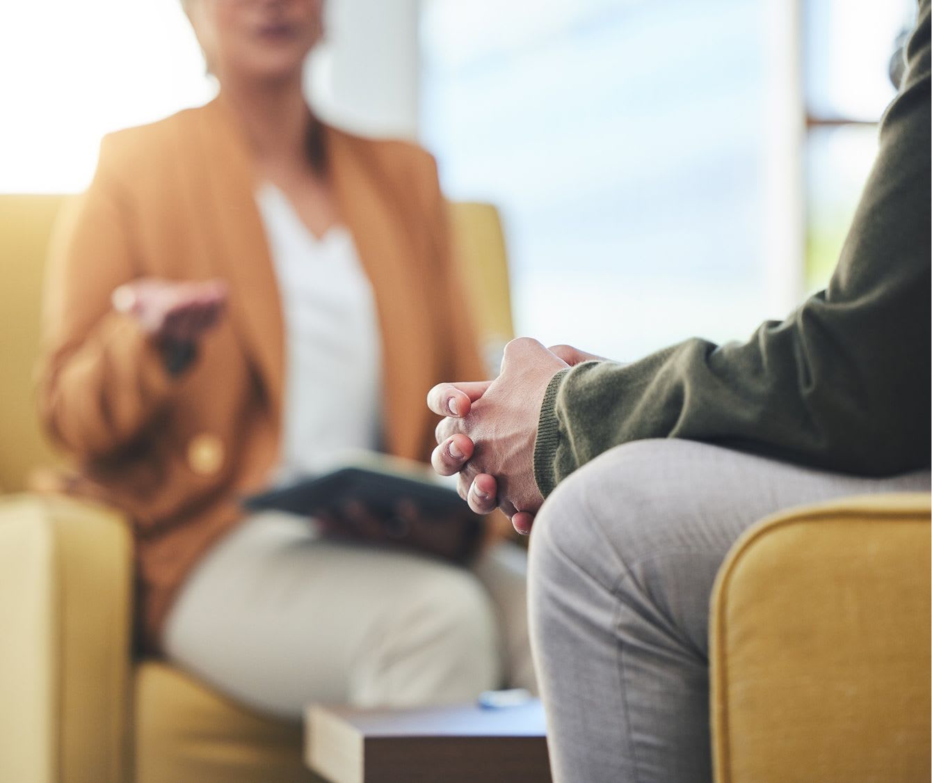 therapy session between a man and his counselor