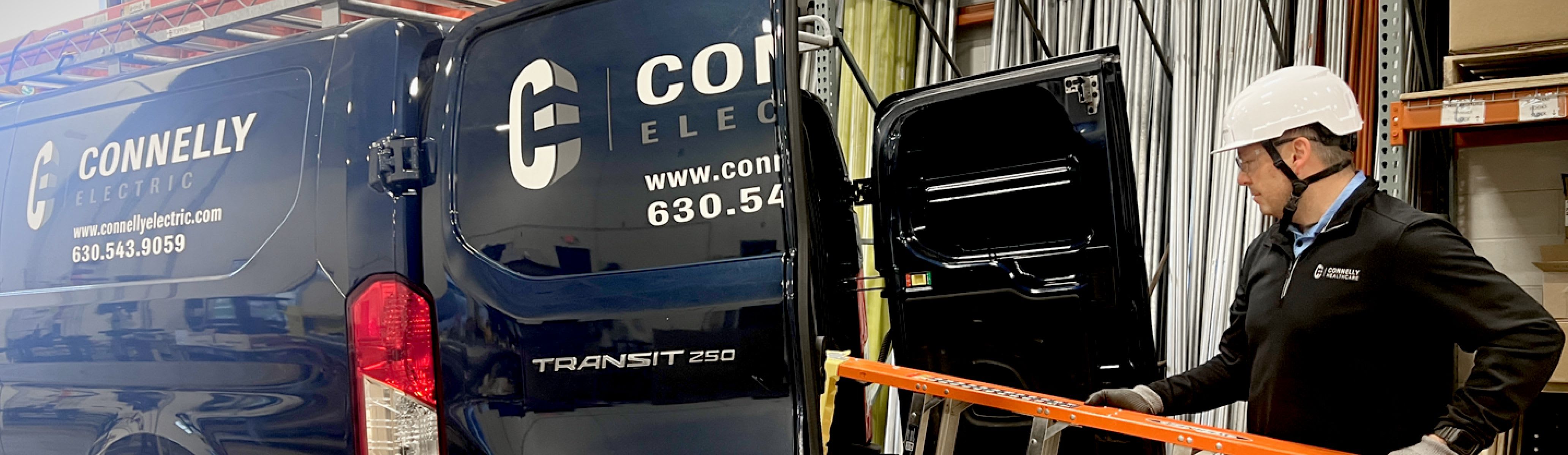 A Connelly Electric Maintenance technician loading a ladder into the service van.