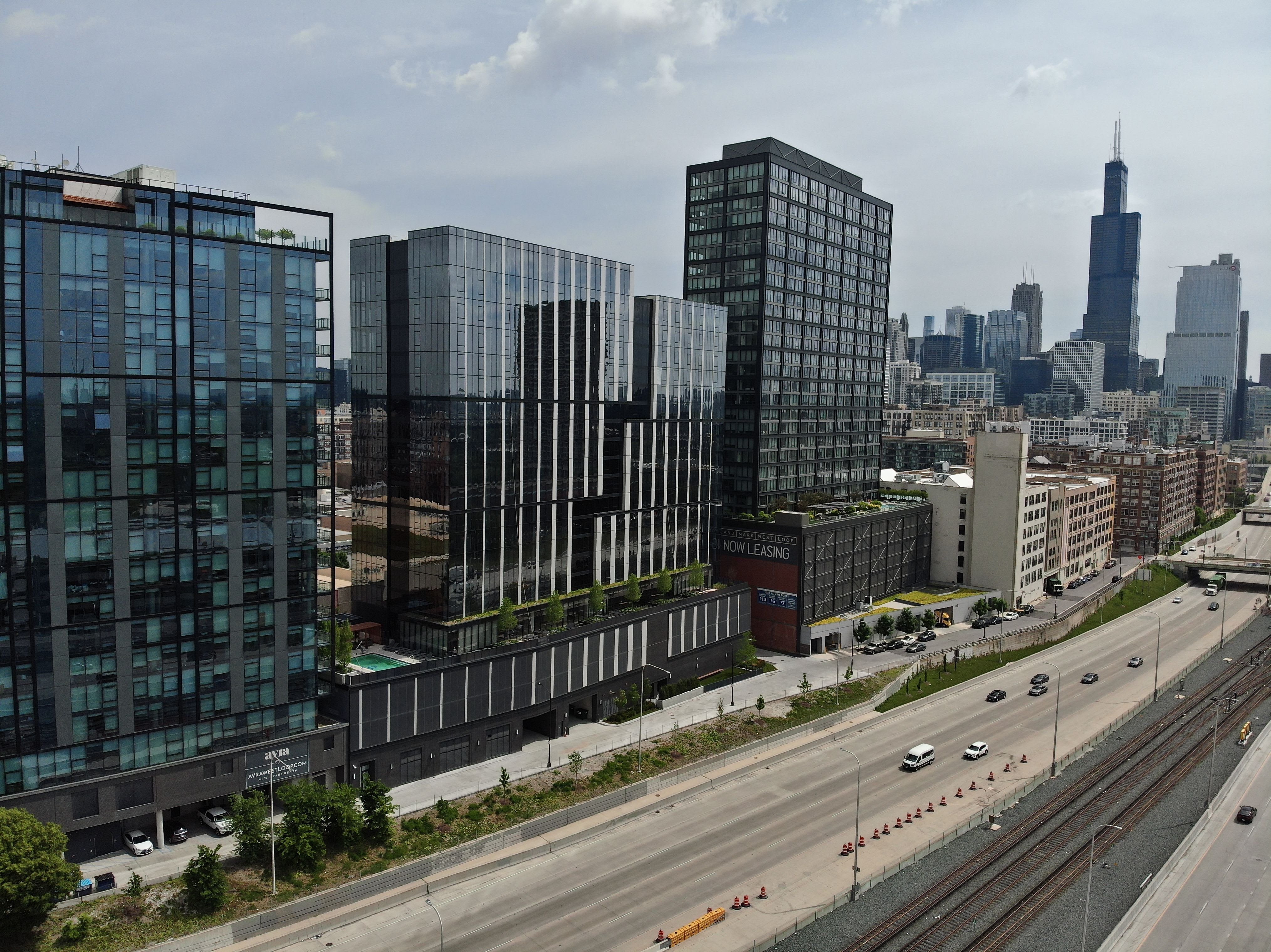 The exterior view of three high-rise buildings in Chicago, including 1101 W. Van Buren.