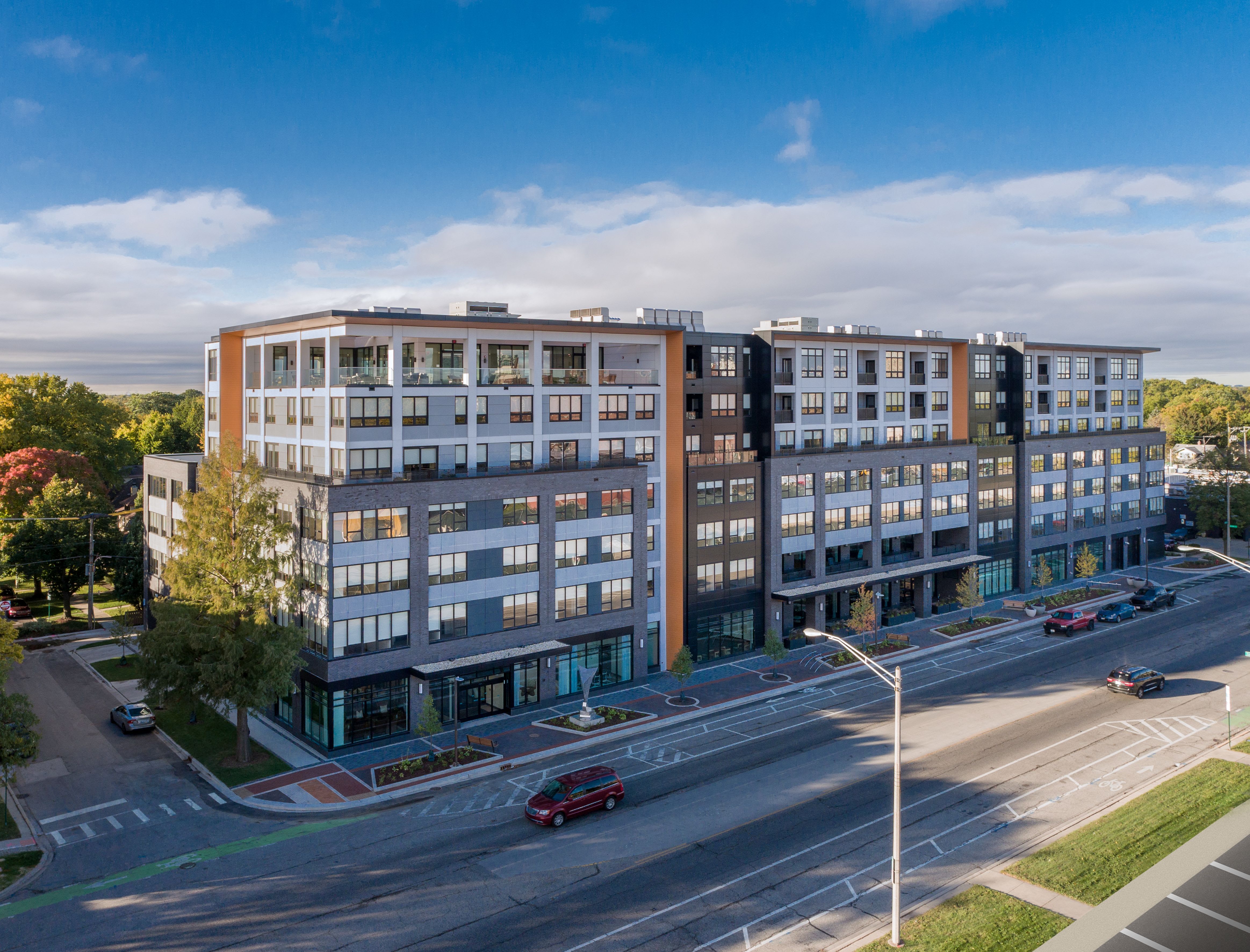 Exterior facade of American House Oak Park Senior Living during the daytime.