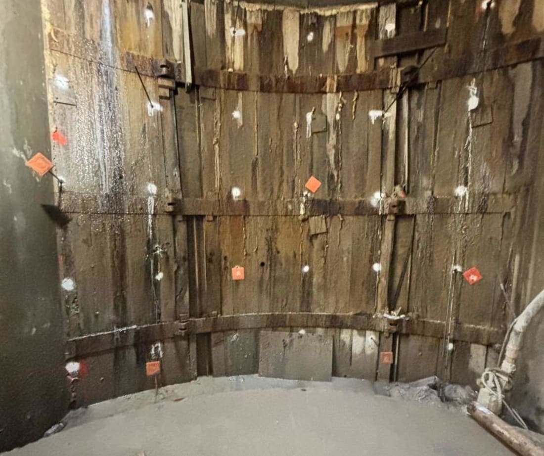 image of wood lagging with injection rods placed to inject polyurethane through. These injections would provide soil stabilization behind the lagging