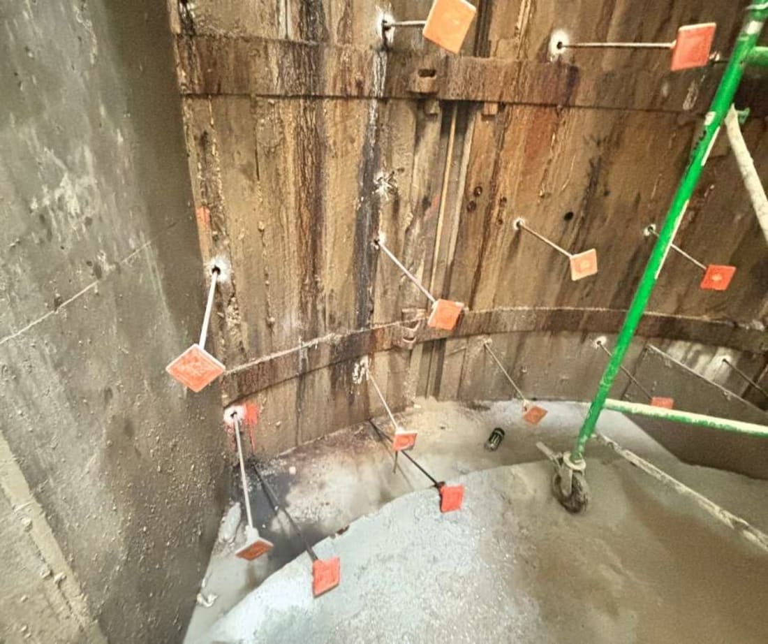 image of wood lagging with injection rods placed to inject polyurethane through. These injections would provide soil stabilization behind the lagging
