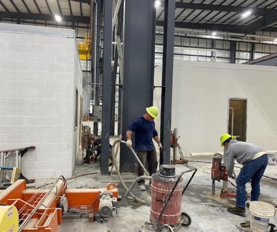 image of Superior Grouting employees preparing for polyurethane injection crane stabilization