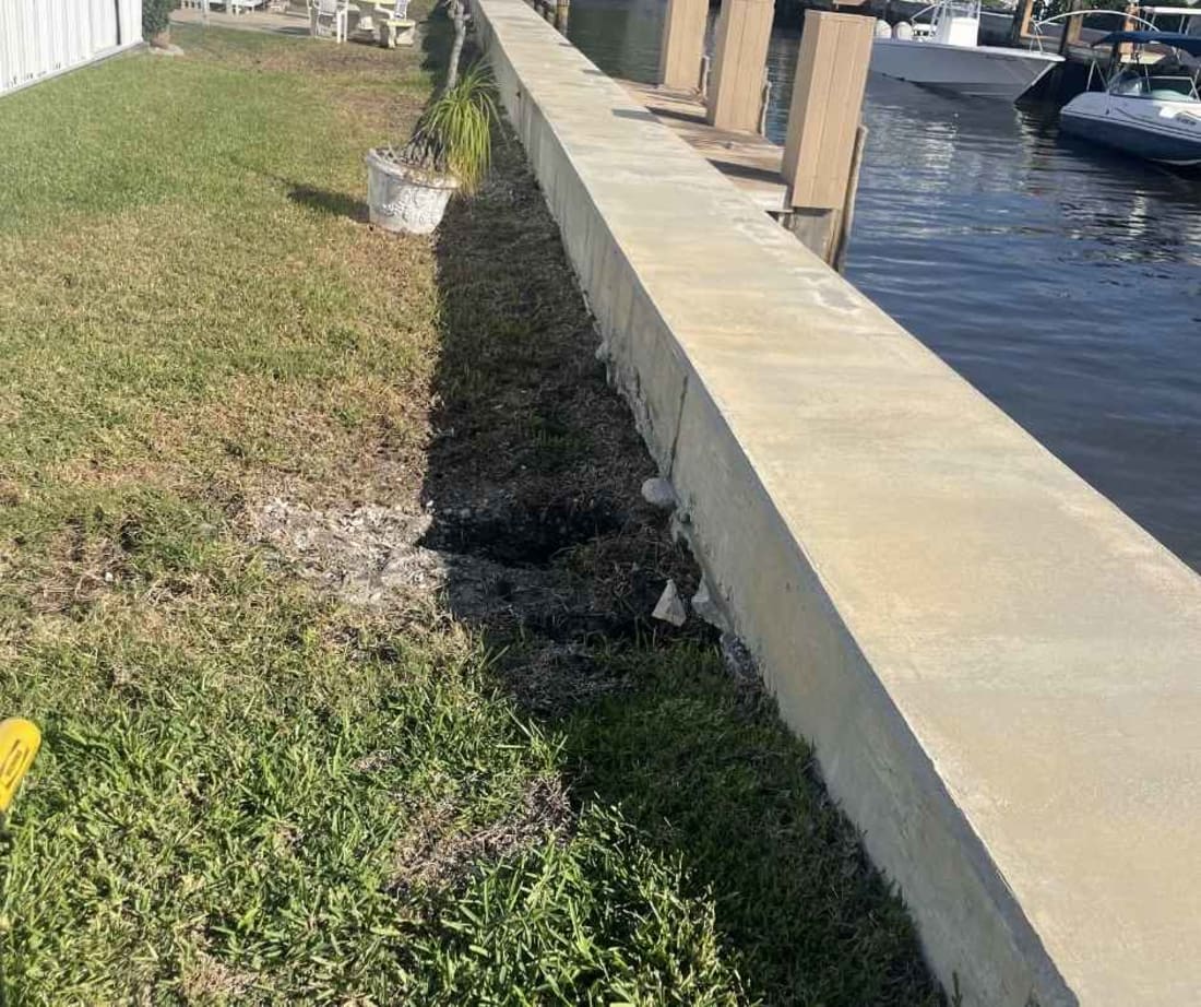 image of seawall experiencing soil loss