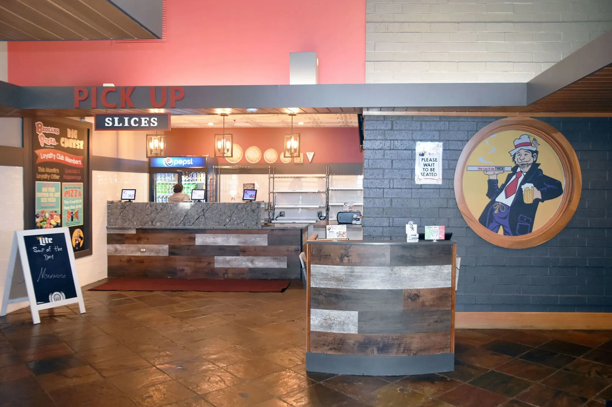 The interior entrance to Beggars Pizza in Bolingbrook