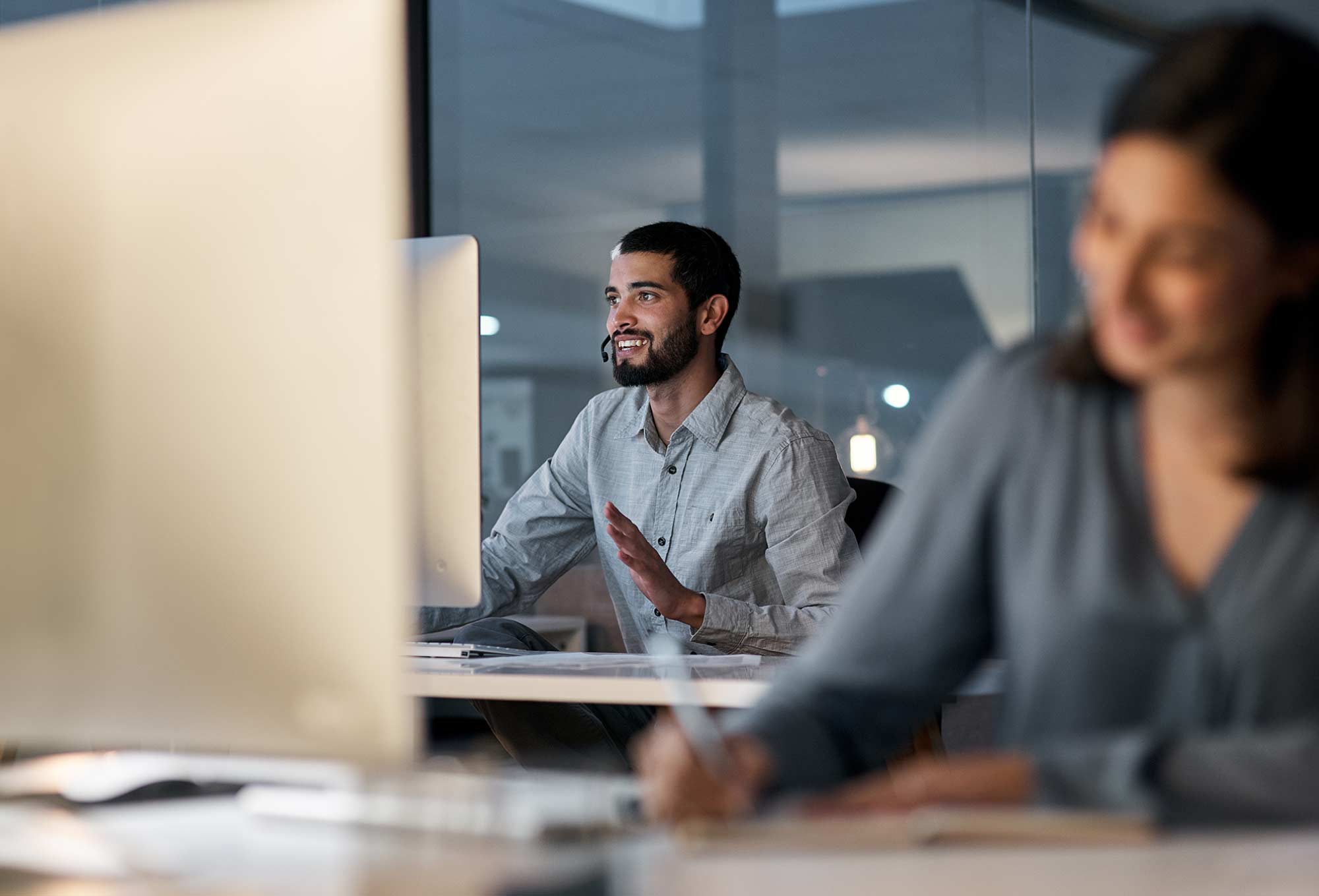 people working at computers and smiling