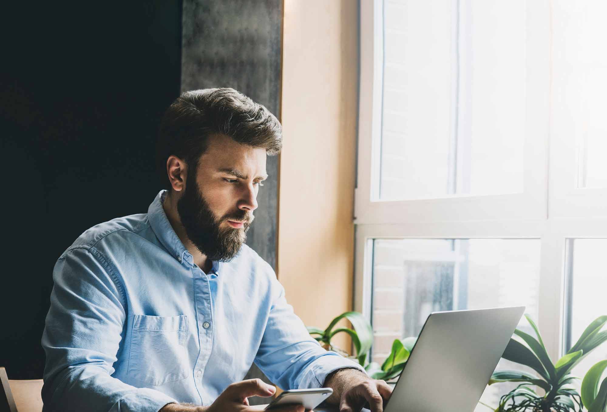 man typing on keyboard to learn how to improve sales performance | 5 innovative technologies that can actually improve sales performance