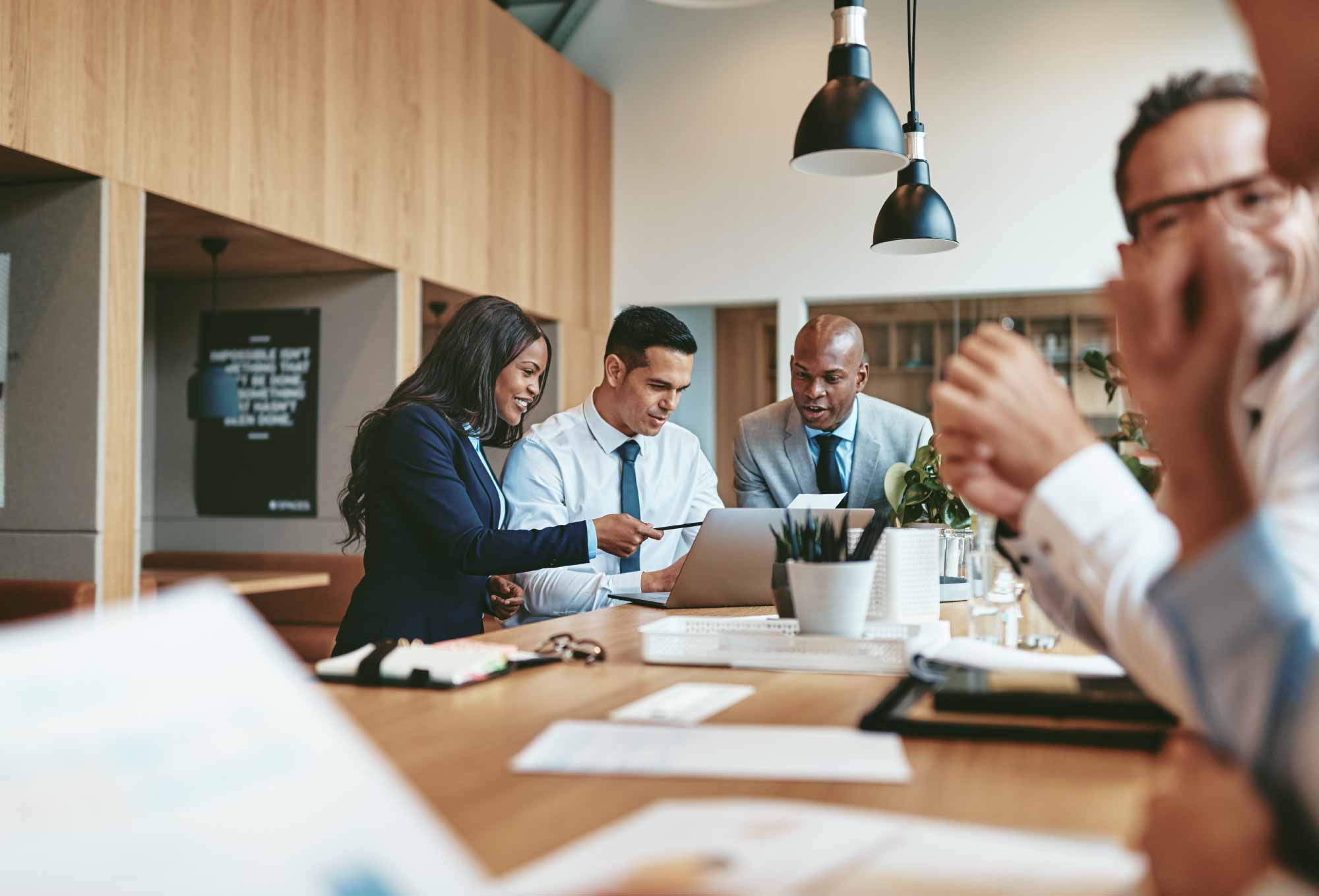 a group of people working in an office