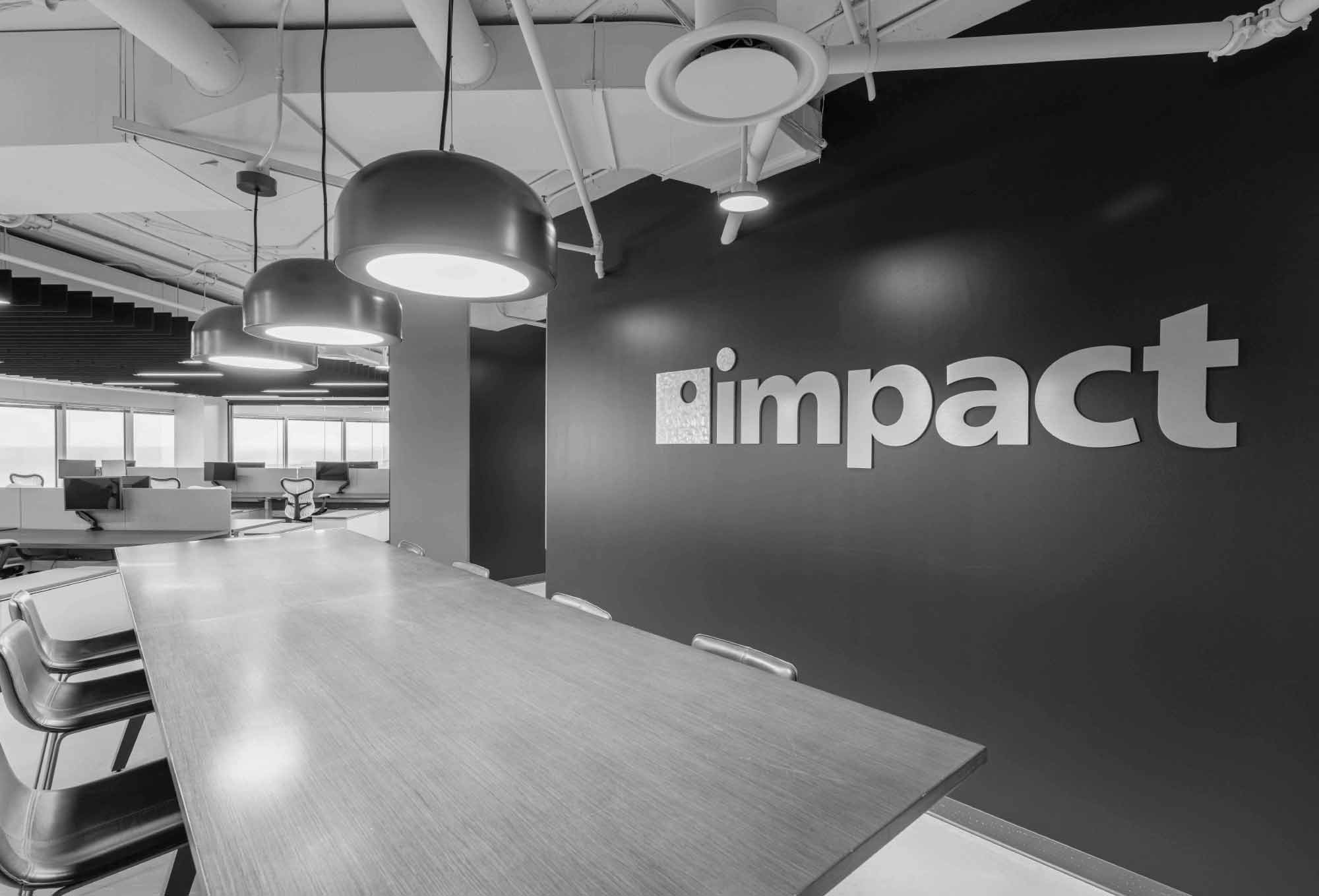 black and white image of an office kitchen at Impact's managed marketing office