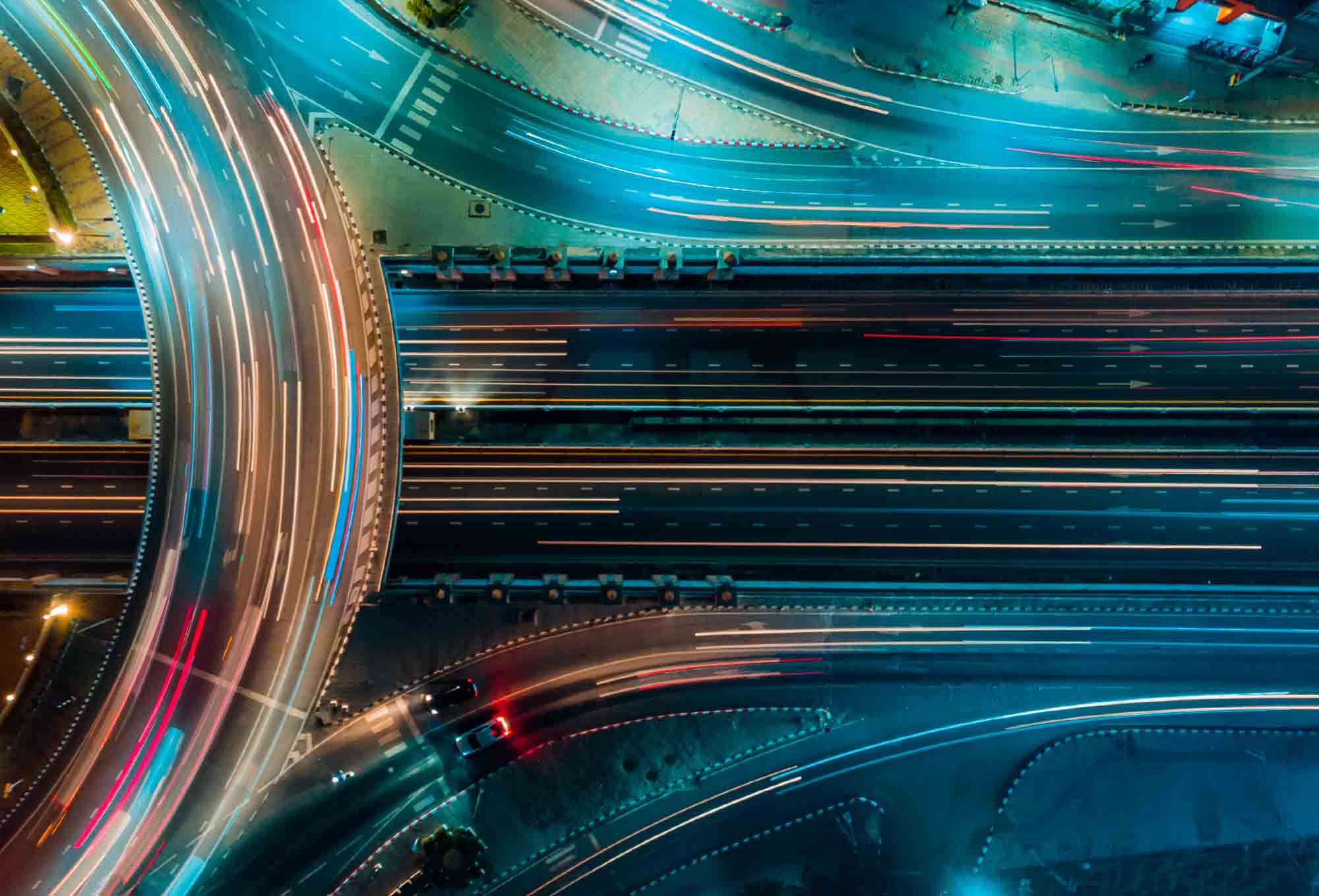 high speed cars on highways crisscrossing