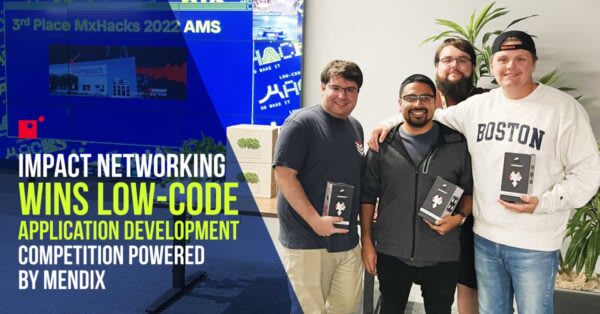 Team of four developers hold awards in group photo