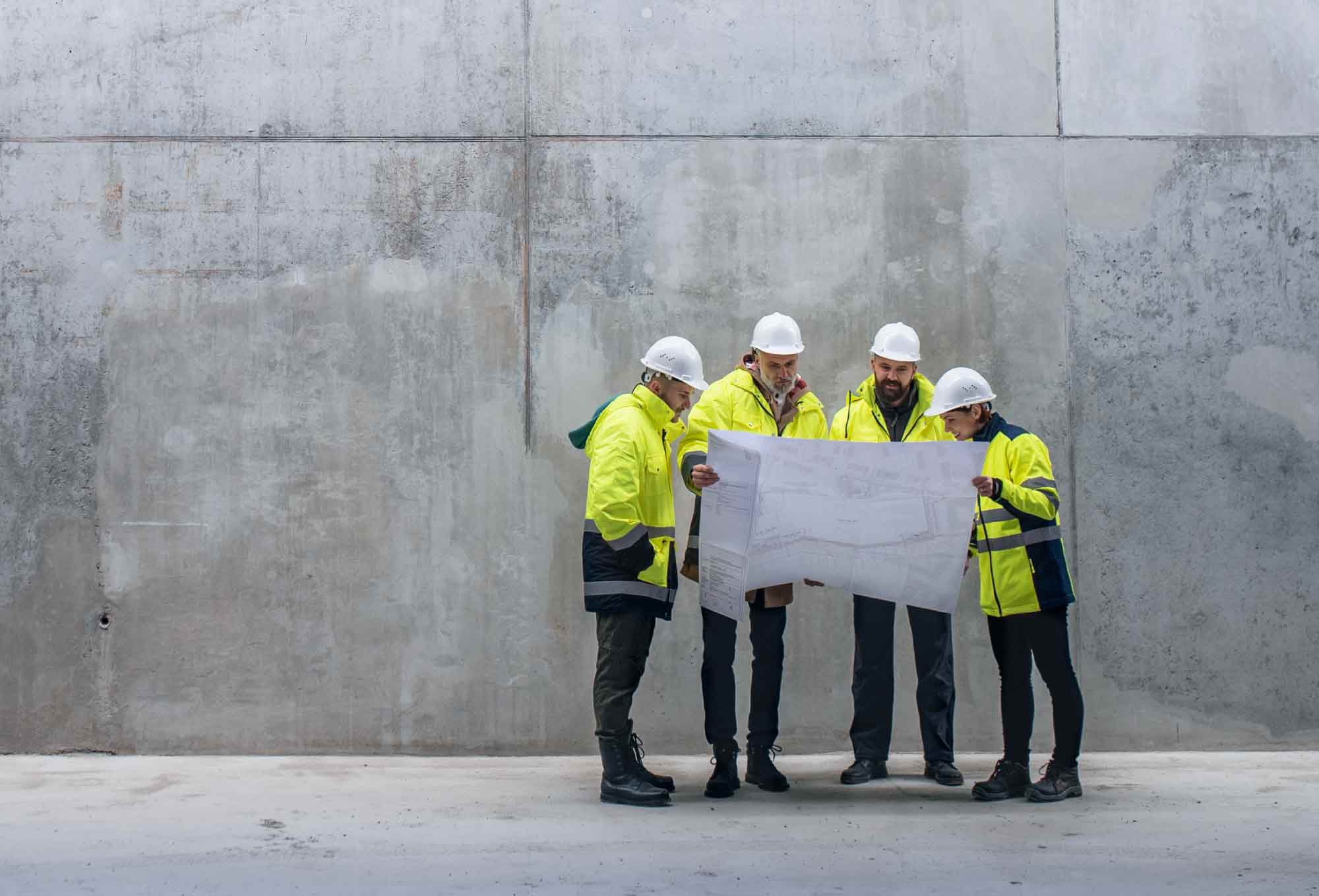 construction workers looking at a plan
