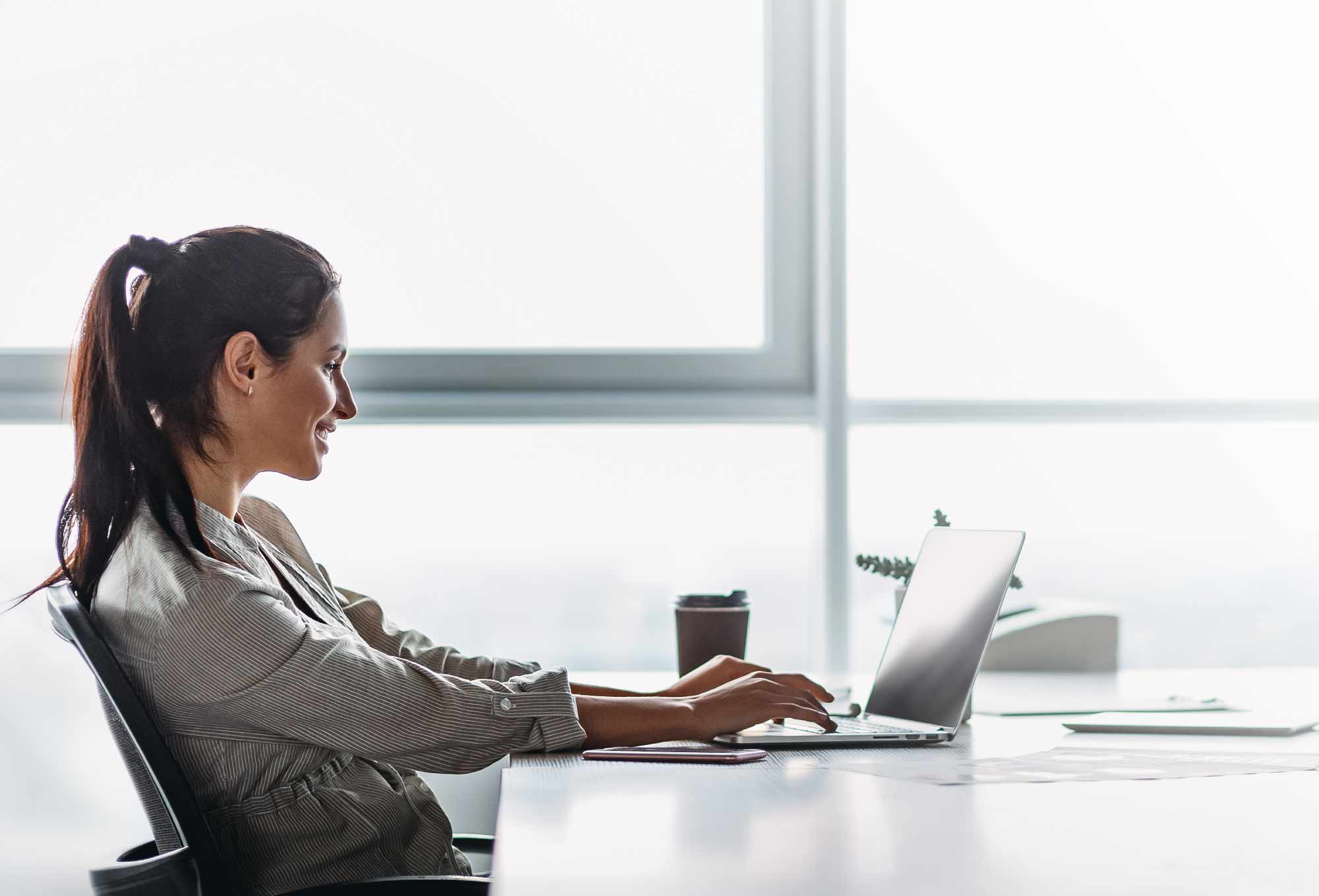 woman looking at a laptop