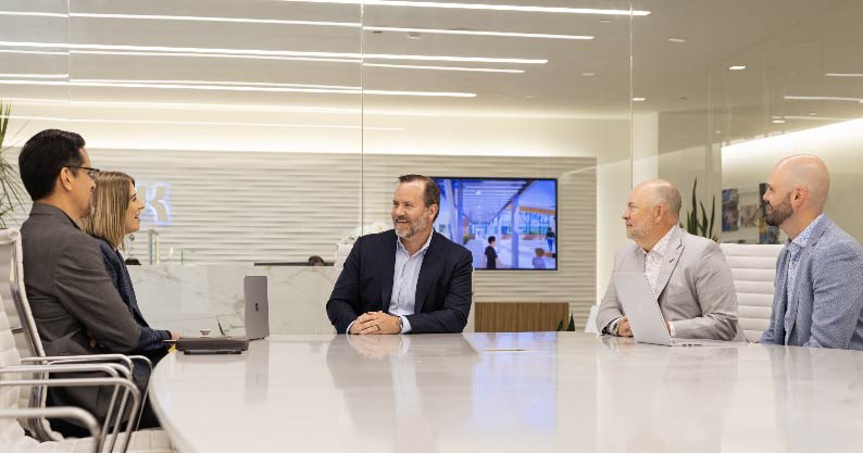 group of people talking in a conference room
