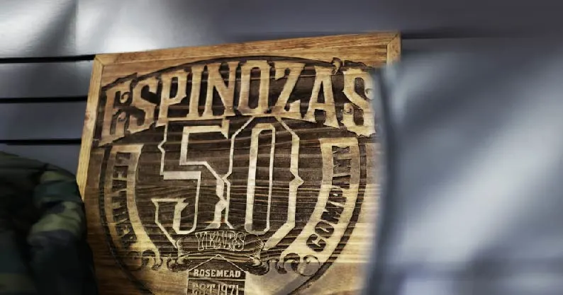 espinoza leather company logo engraved in wood