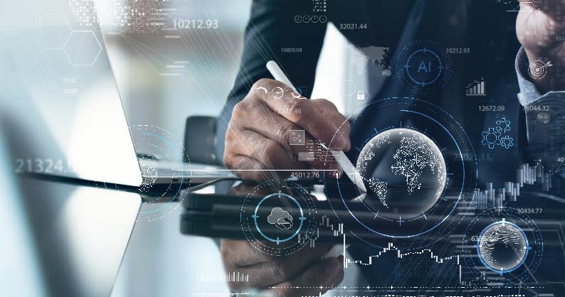 hand writing on table with icons around the hand