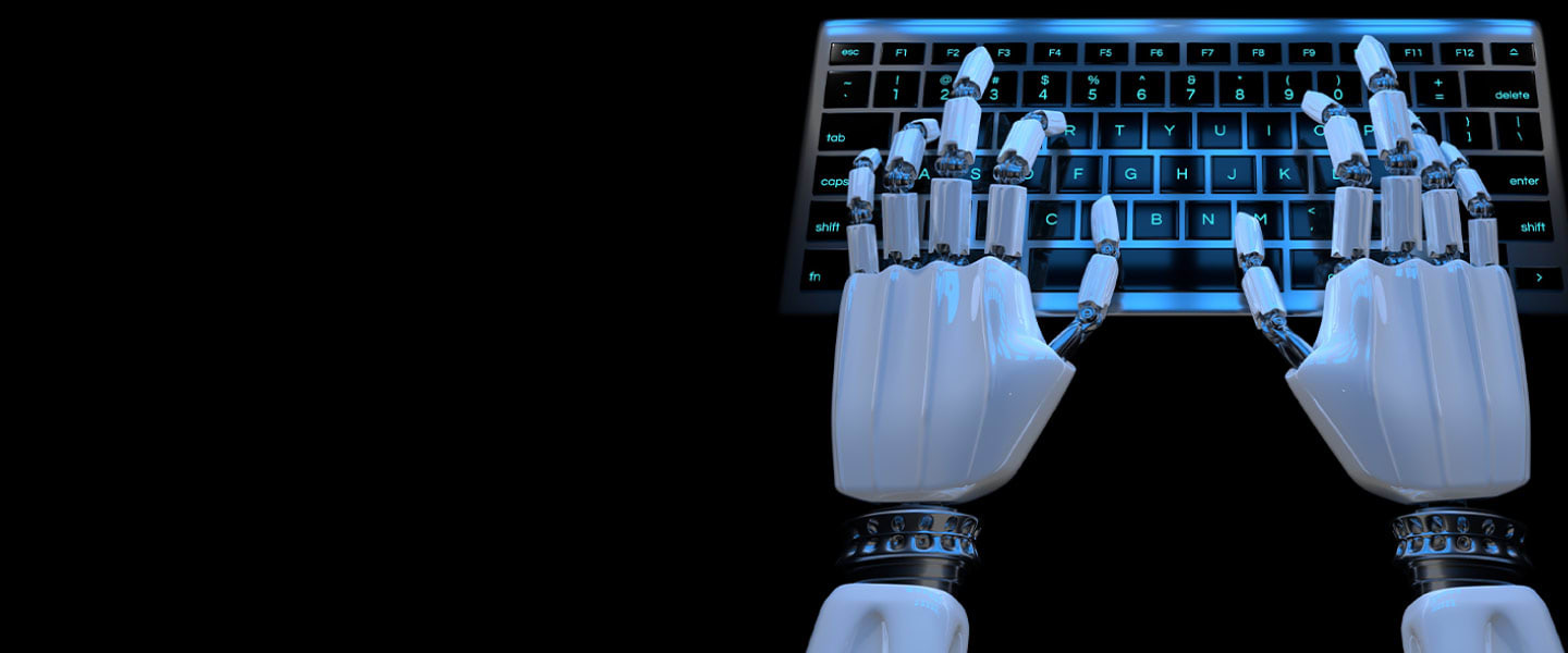 Robot hands typing at a keyboard