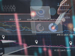 A stylus touching a transparent screen filled with graphics and data