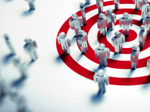 silver figurines scattered across a red bullseye 