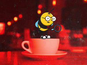 animated bee with glasses holding a magnifying glass, standing on top of a coffee cup