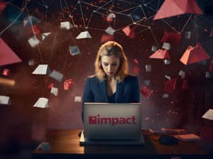 A woman sitting at an open laptop in a field of hanging geometric shapes