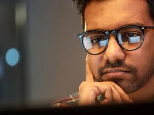 man with glasses pondering | what is a vcio and does your business need one?