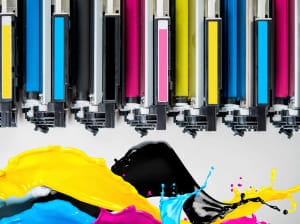 Toner bars next to pools of colored ink