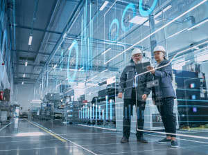 A pair of construction site managers working on a tablet and digital display