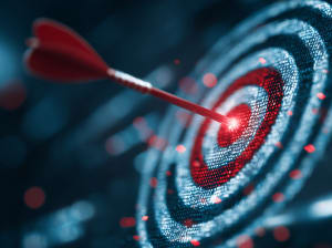 A dartboard target with a dart stuck in the bullseye