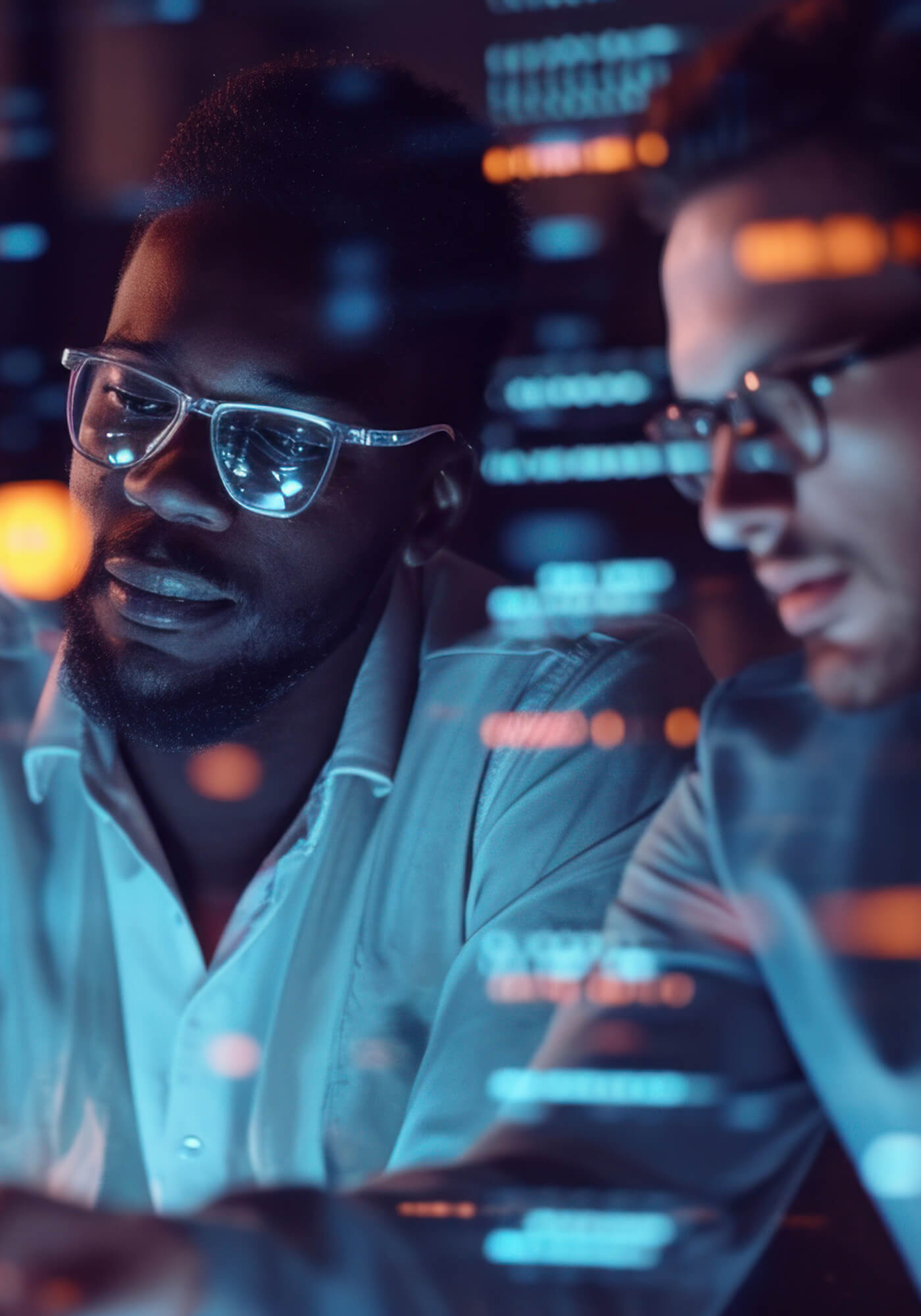 Two IT technicians looking at an issue together