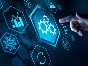 A person's hand with the index finger extended, about to press a hexagon with 3 gears in the middle on a digital dashboard