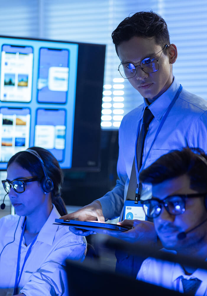 Three SOC workers diligently doing their jobs