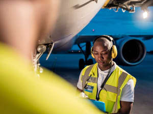 An air traffic controller working on a tarmac