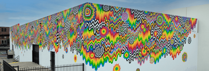 Impact Networking office building in the Arts District in Los Angeles with an intricate, trippy tie-dye drip mural on it