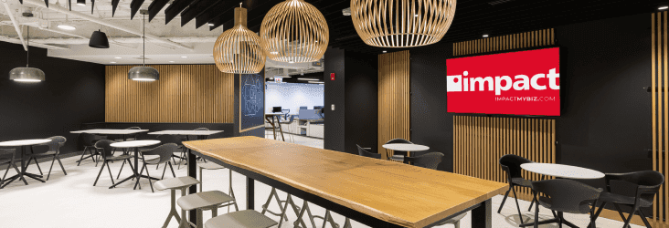 Large wooden conference table with chairs surrounding the table.