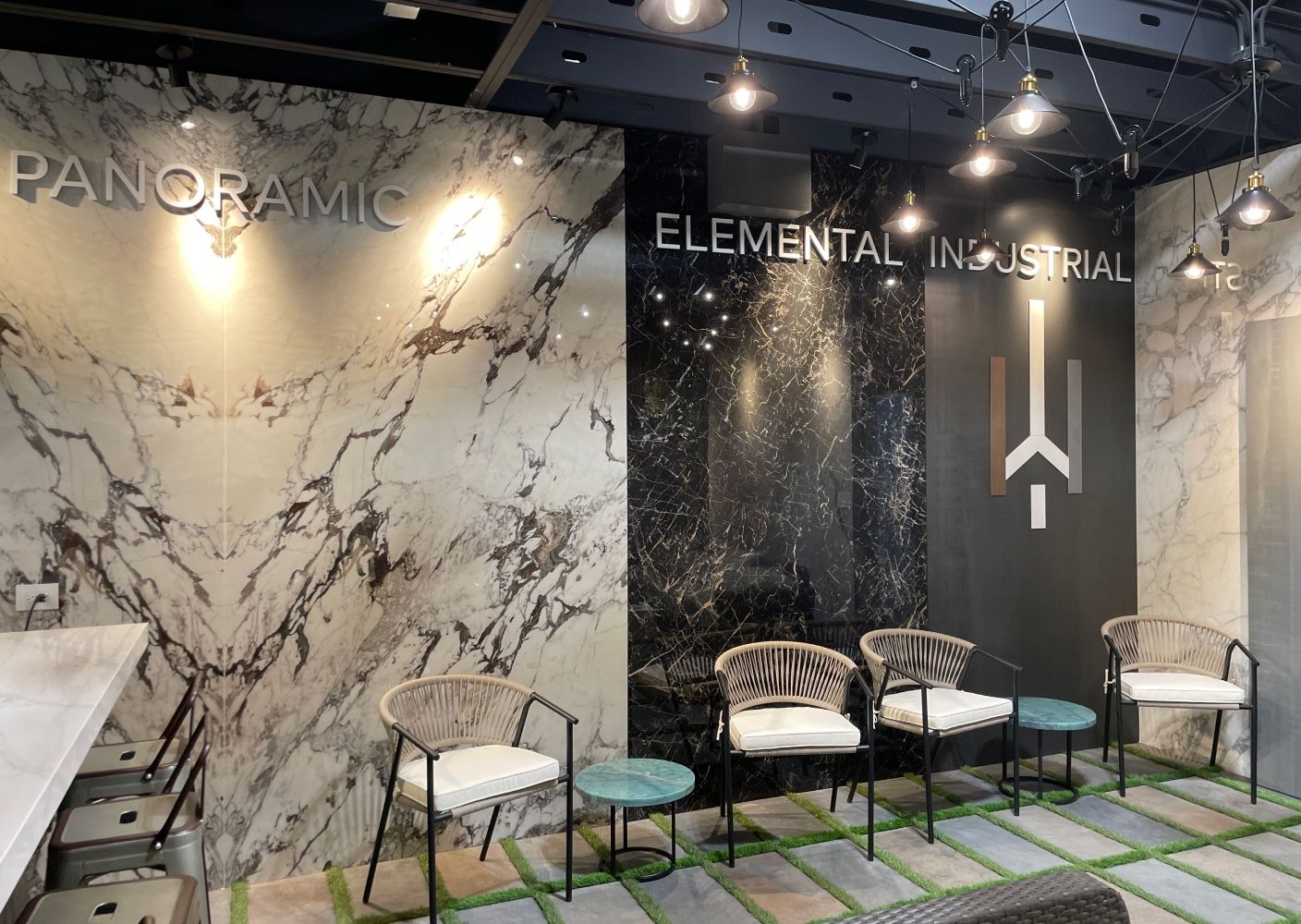 Wall made of stone slabs that read "panoramic", "elemental", "industrial"