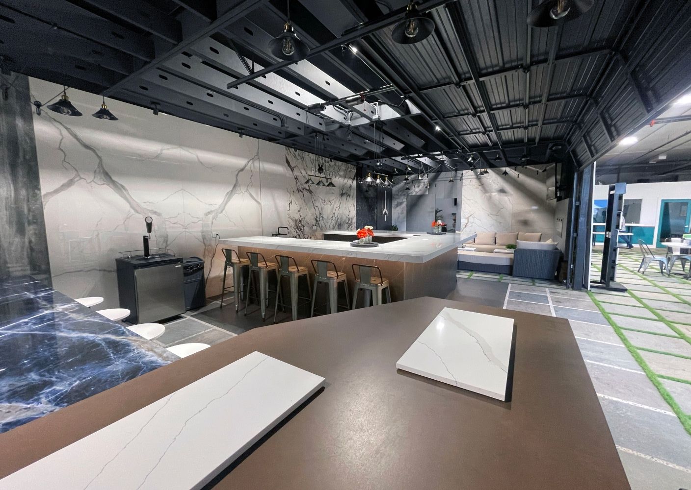 Atlantis Granite and Quartz Showroom with blue countertops and various slabs as walls