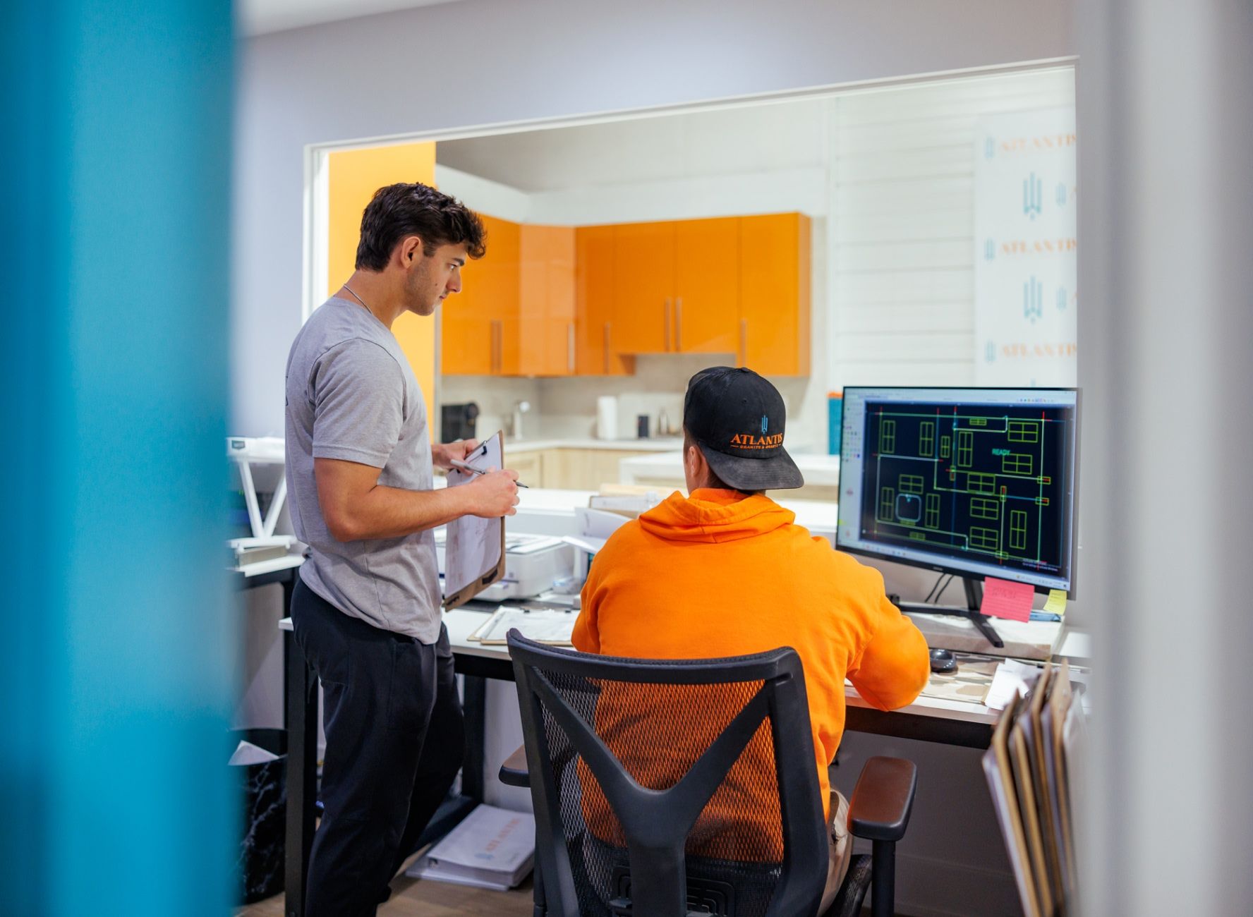 Bruce Pinsler, Sam Pinsler, and PJ Ryan having a celebratory drink with a prospective client at Atlantis HQ