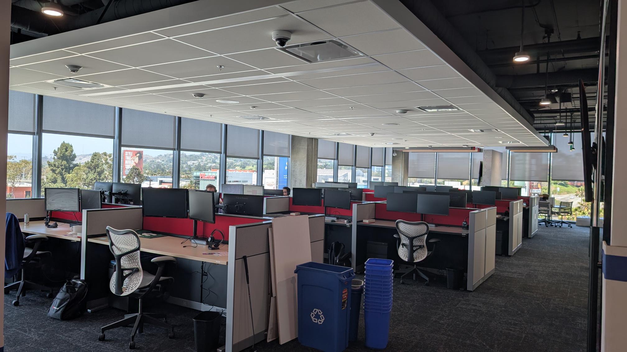 Rows of freshly assembled desks in the Impact Culver City office