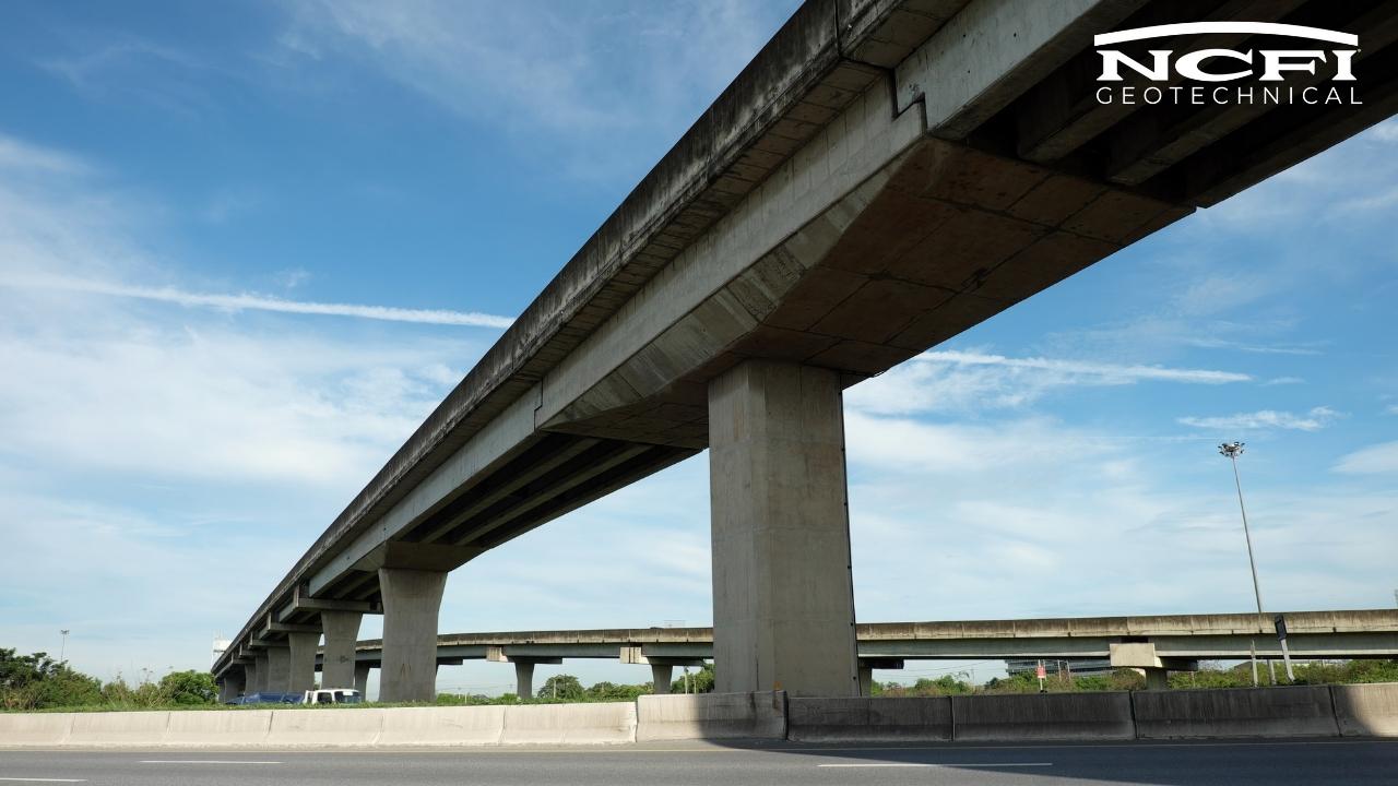 image of bridge from below with NCFI Geotechnical logo. This is an article cover image for Bridge Transition Slab Realignment with Dual Component Polyurethanes